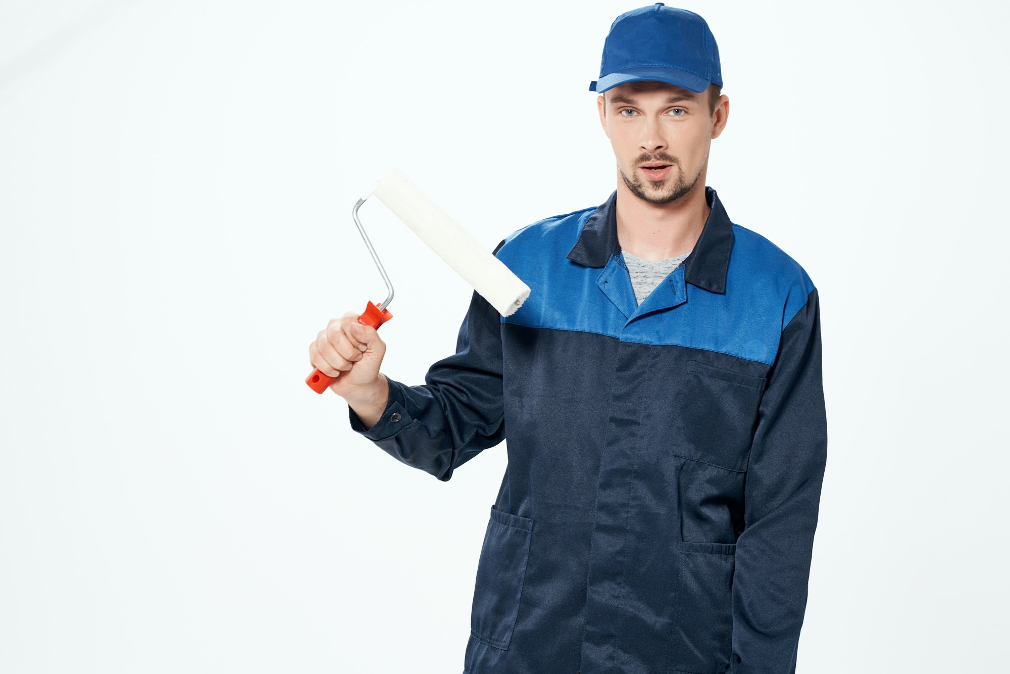 man in working uniform home repair painting service